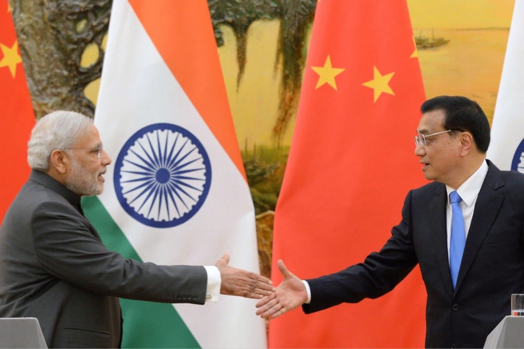 Chinese Premier Li Keqiang (right) and his Indian counterpart Narendra Modi shake hands at the end of their joint press conference in Beijing. Both sides emphasised building trust. Photo: Kyodo