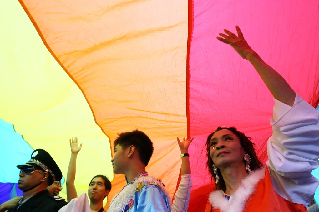 LGBTs take part in a pride parade in Hong Kong. A lesbian couple are challenging the practice of granting dependant visas to heterosexual spouses but denying homosexuals in Hong Kong. Photo: K.Y. Cheng