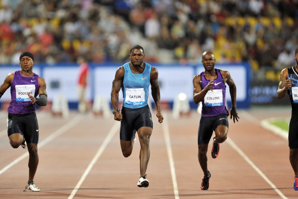 Michael Rodgers and Justin Gatlin, both of the US, Kim Collins of St Kitts and Nevis and Keston Bledman of Trinidad and Tobago fly down the straight in Doha. Photo: EPA