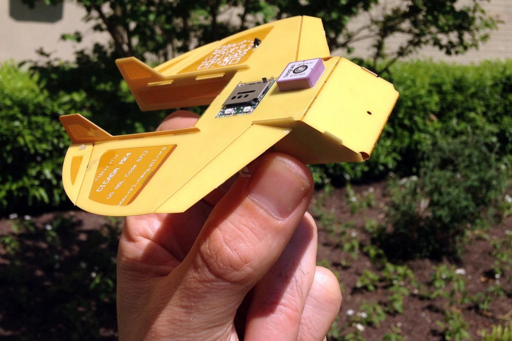 A man holds a Cicada, a miniature drone. Photo: AFP