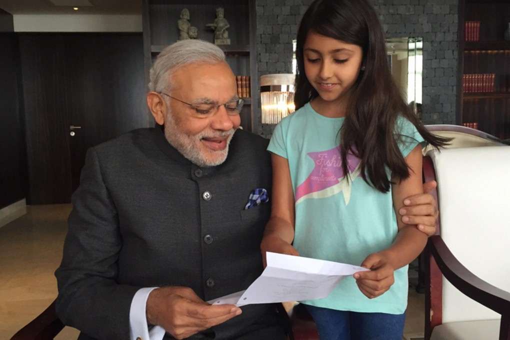 India's Prime Minister Narendra Modi meets Hong Kong resident Melody Sabnani in Shanghai. Photo: SMP Pictures