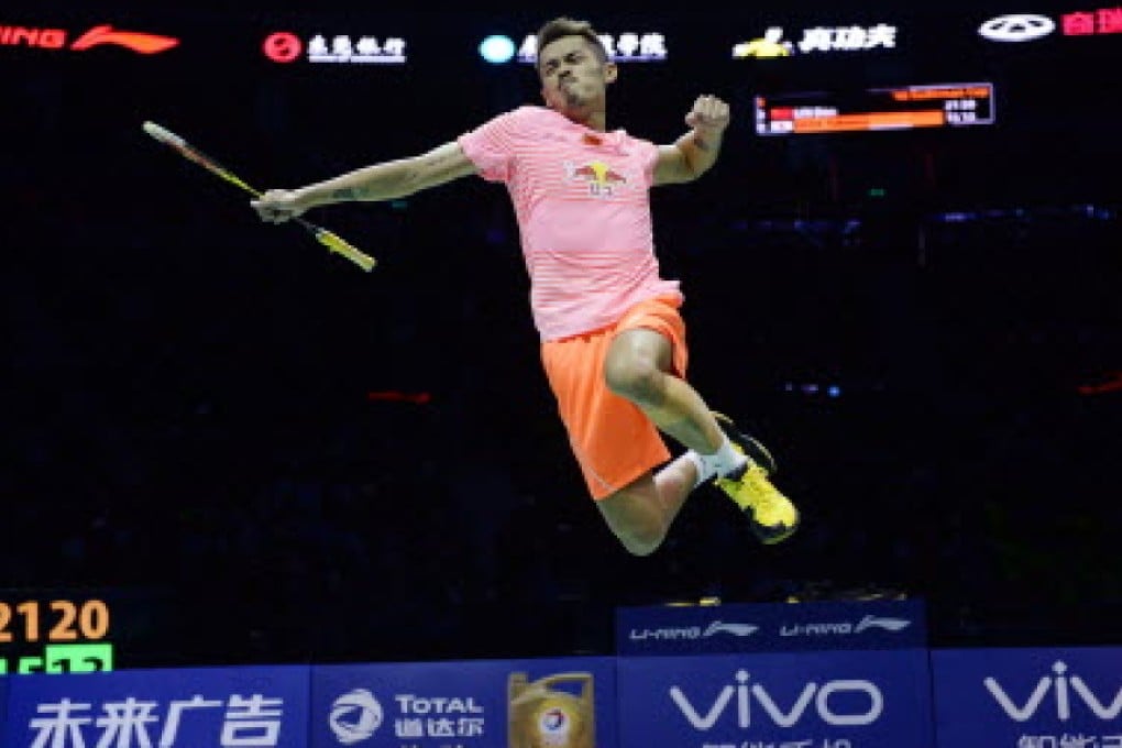 Lin Dan leaps for joy after winning his men's singles match in the Sudirman Cup final against Japan's Takuma Ueda. Photo: AFP