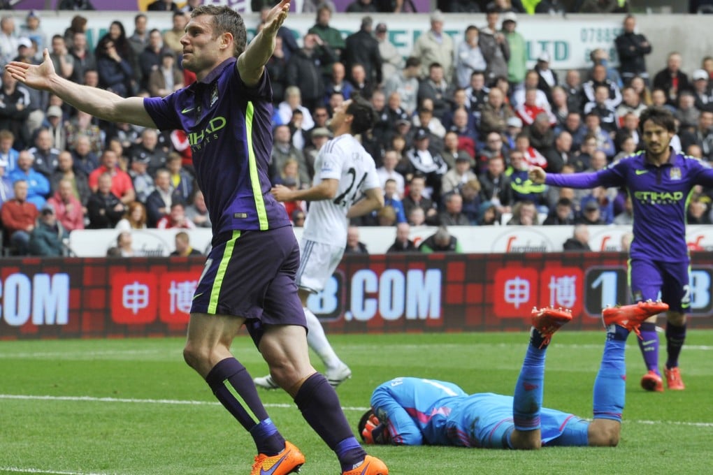 James Milner celebrates after scoring Manchester City's second goal in their 4-2 English Premier League win over Swansea. Photo: Reuters