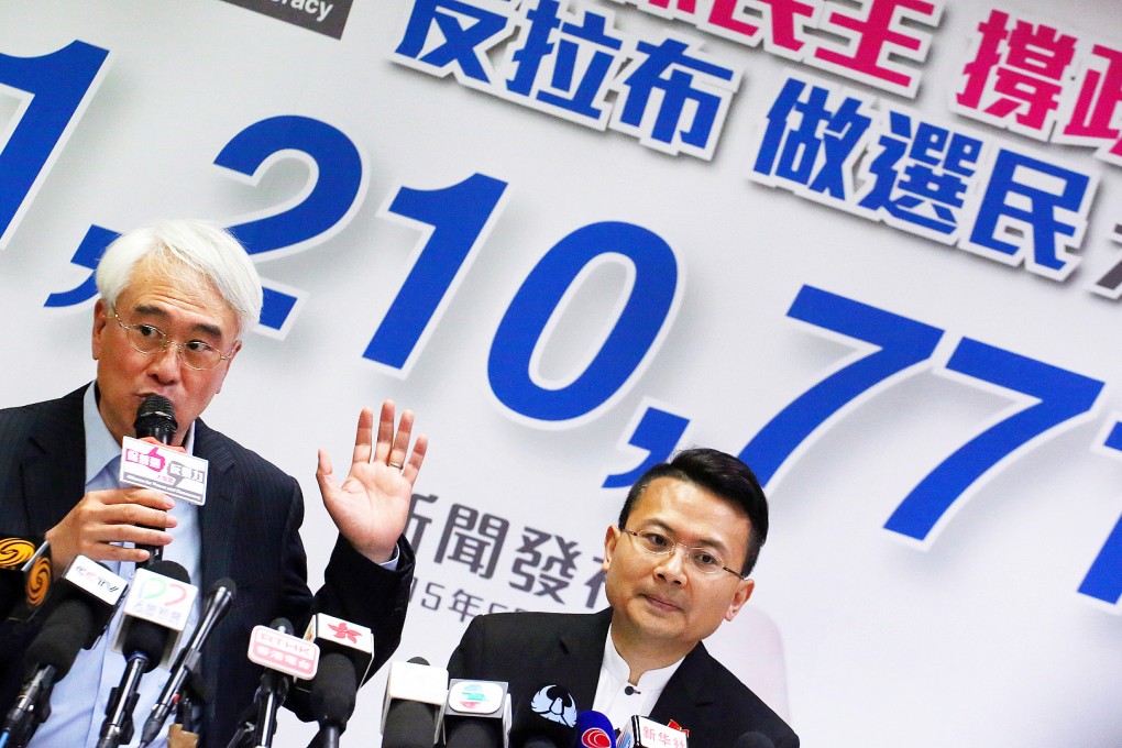 Robert Chow Yung (left) and Brave Chan Yung of Alliance for Peace and Democracy meet the media at the First Commercial Building in Causeway Bay on Monday. Photo: Felix Wong