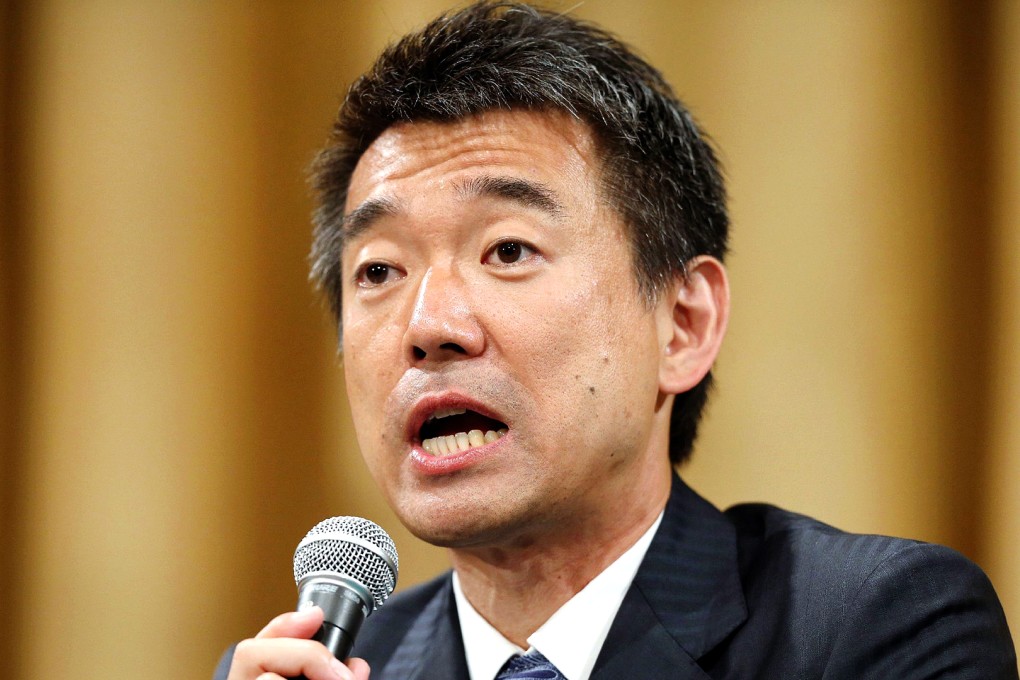 Osaka Mayor Toru Hashimoto speaks to media as a referendum to reform the city administration into a metropolitan government was rejected. Photo: AFP