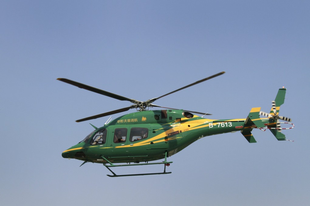 Customers fly from Beijing city area to Yanxi Lake during a trial helicopter hailing service launched by Reignwood Star and Didi Kuaidi. Photo: Reuters
