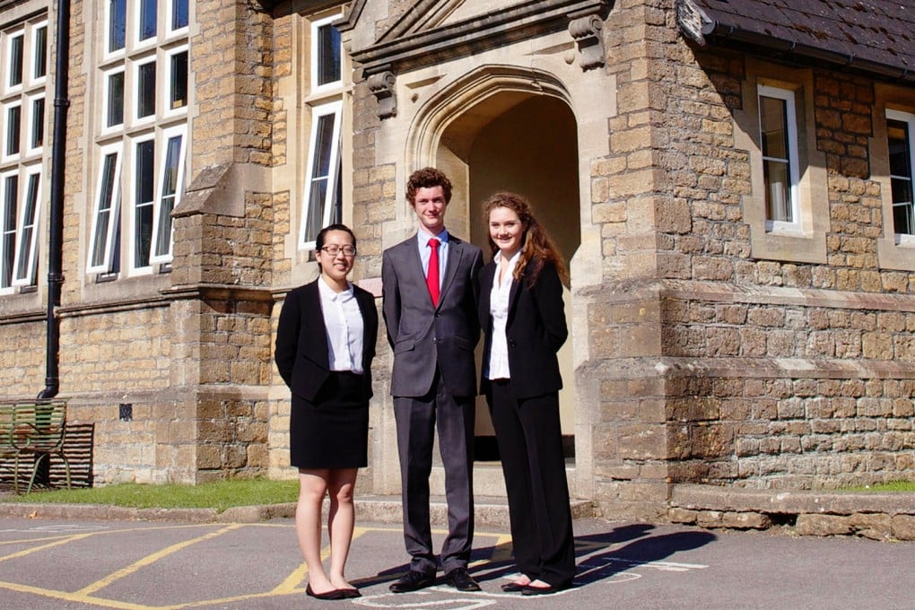 Head girl for boarders Phoebe Hung (left) with Sexey's head boy and head girl.