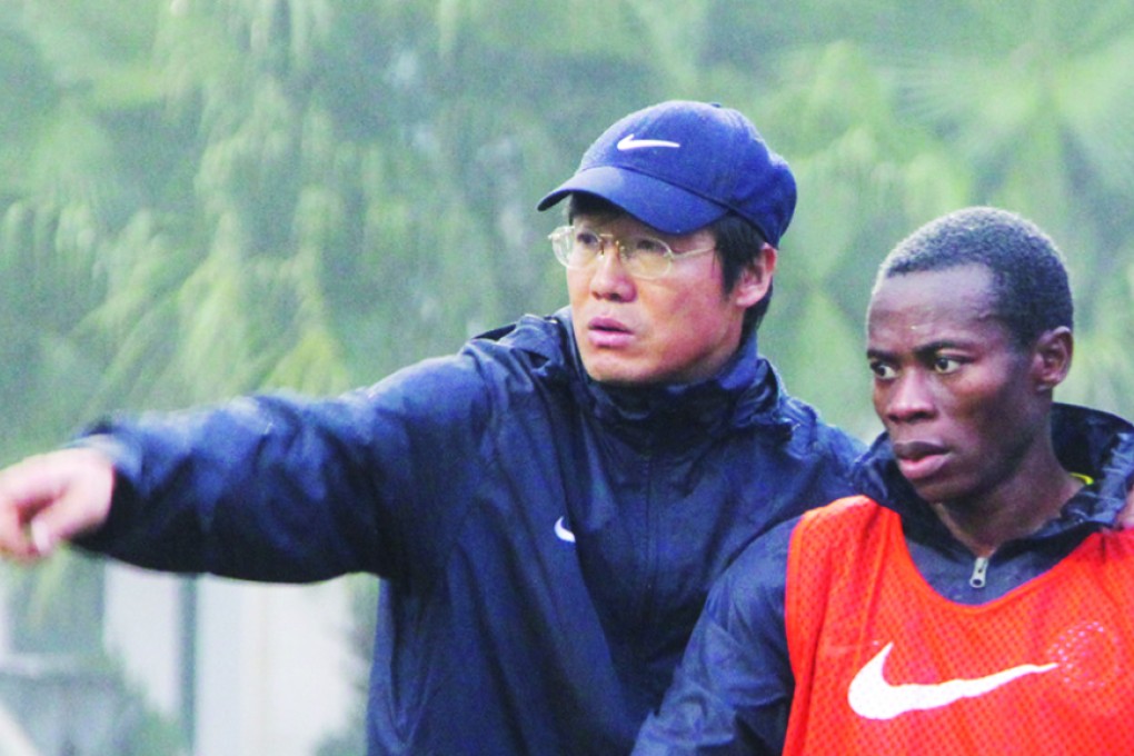 Coach Kim Pan-gon with Ghana-born Hong Kong international Christian Annan. Photo: SCMP