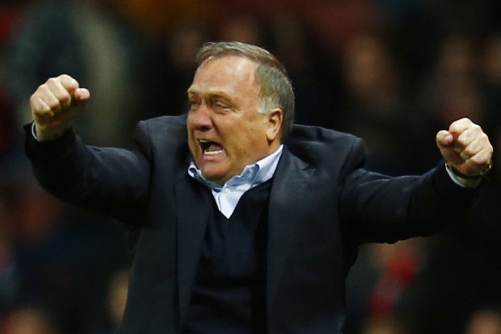 Sunderland manager Dick Advocaat celebrates a 0-0 draw at Arsenal - and avoiding relegation. Photo: Reuters