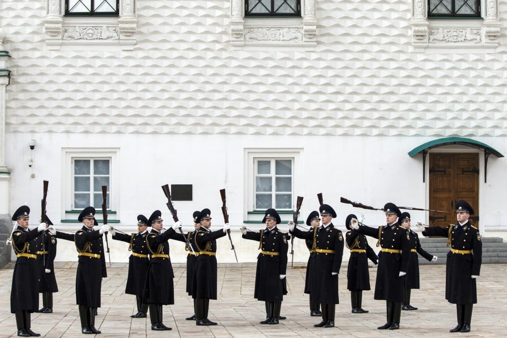 Kremlin guards perform at the Cathedral Square during a ceremony of the Changing of the Guard in the Kremlin, in Moscow, Russia. Photo: AP
