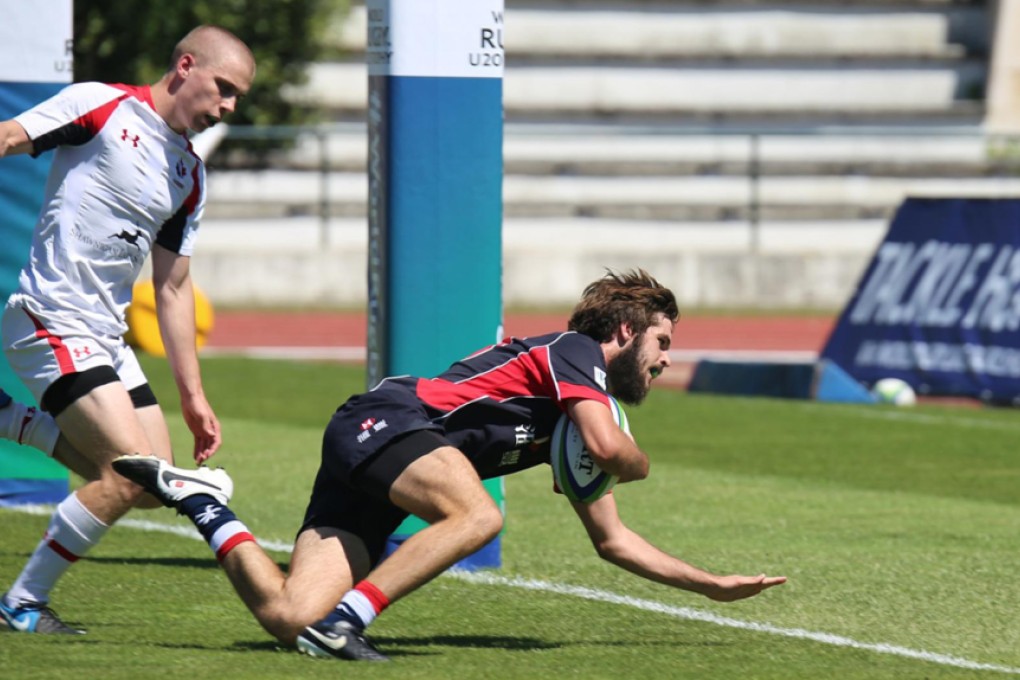 Hong Kong’s Liam Owens gets across the line against Canada during their pool encounter at the World Rugby Under 20 Trophy in Portugal. Photos: World Rugby