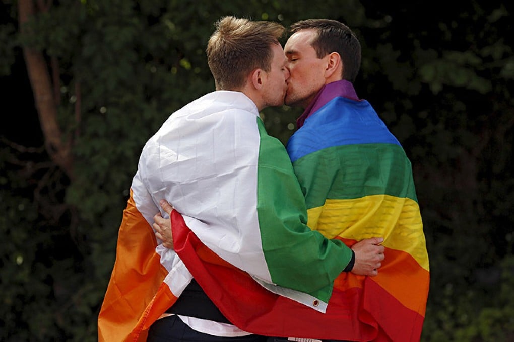 A couple embraces outside the count centre in Dublin as Ireland holds a referendum on gay marriage. Photo: Reuters