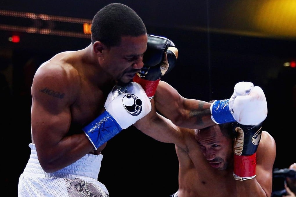 Andre Dirrell and James DeGale exchange punches in their super middleweight title bout. Photo: AFP