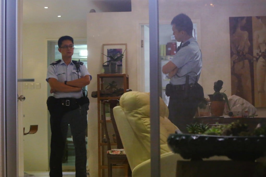 Police investigators at the family's Tai Tung village home on Friday. Photo: Edmond So