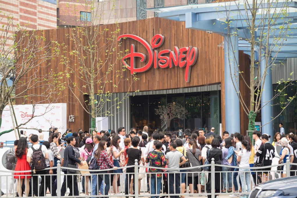 Enthusiastic shoppers have been queueing for hours to enter China’s first Disney store after it opened in Shanghai last week. Photo: EPA