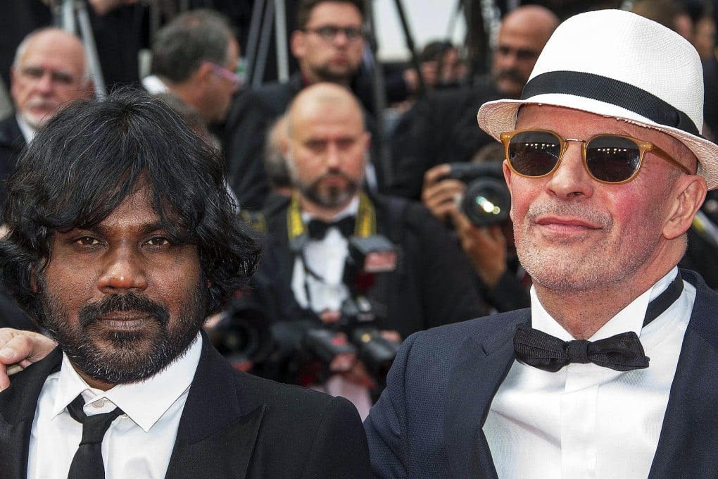 Jesuthasan Antonythasan and director Jacques Audiard arrive for the closing ceremony of the Cannes Film Festival. Photo: Reuters