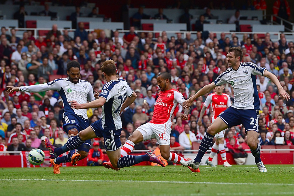 Theo Walcott torments West Bromwich Albion with a stunning first-half hat-trick. Photo: AP