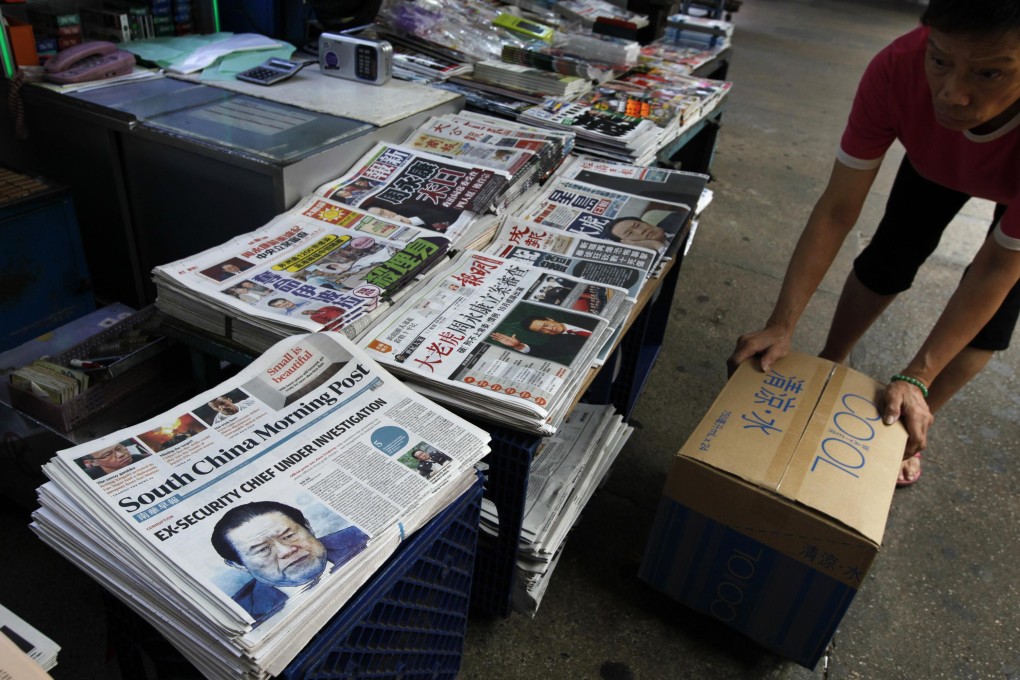 A newspaper stand in Hong Kong, where dailies are struggling to survive the disruptive impact of the internet on the business. Photo: Reuters