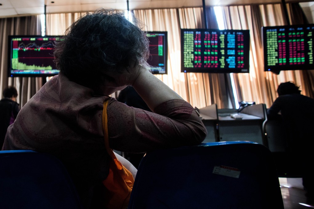 Chinese investors eye stock prices in Shanghai as a flurry of new IPOs are to hit the market this month. Photo: AFP