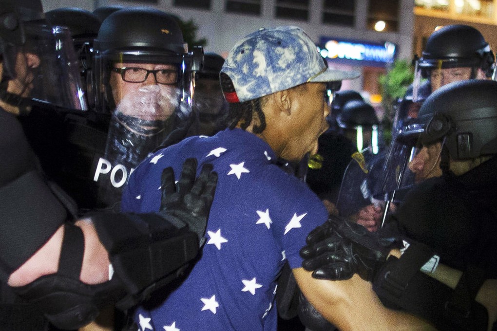A demonstrator is arrested while confronting Cleveland police during a march protesting the acquittal of Michael Brelo. Photo: AP