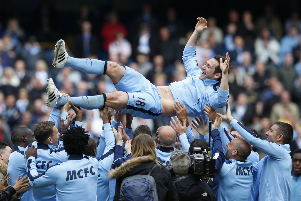 Manchester City's Frank Lampard is thrown in the air by teammates after the 2-0 victory over Southampton.  Photo: Reuters