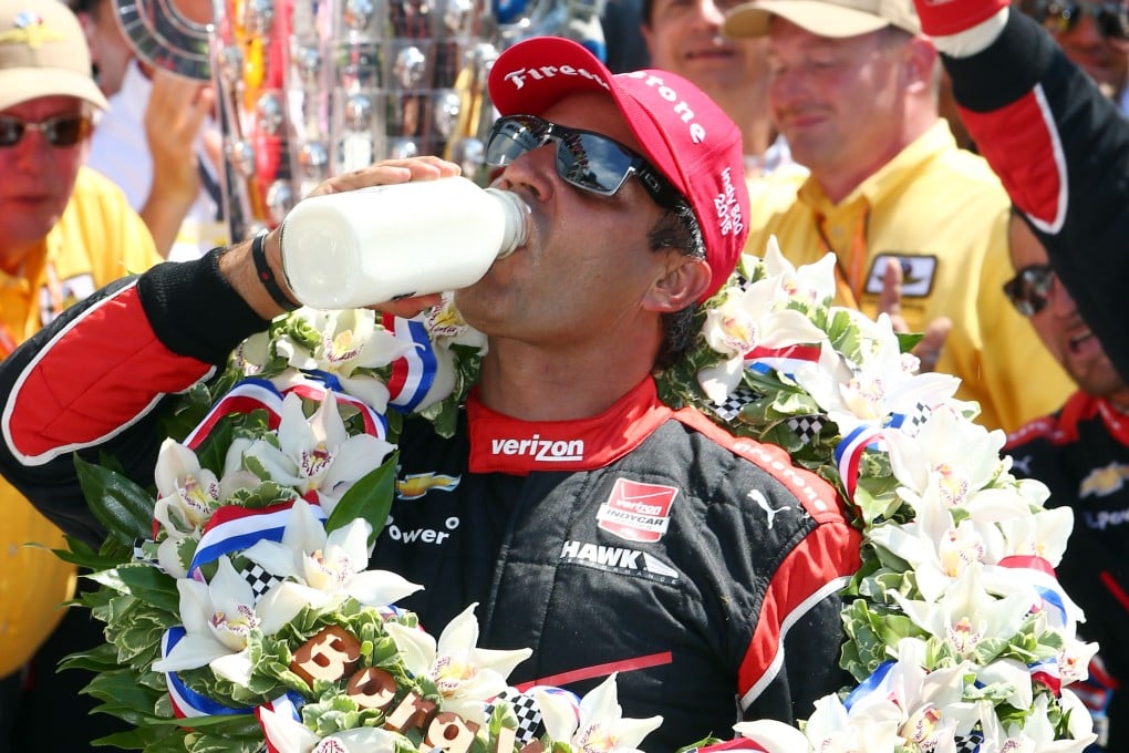 Juan Pablo Montoya celebrates with a swig of milk after winning the Indianapolis 500. Photo: USA Today