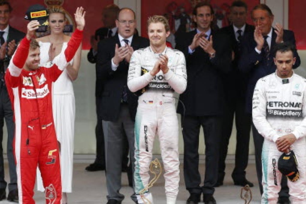 Nico Rosberg celebrates his victory at the Monaco Grand Prix with Sebastian Vettel second and a glum Lewis Hamilton third. Photo: EPA
