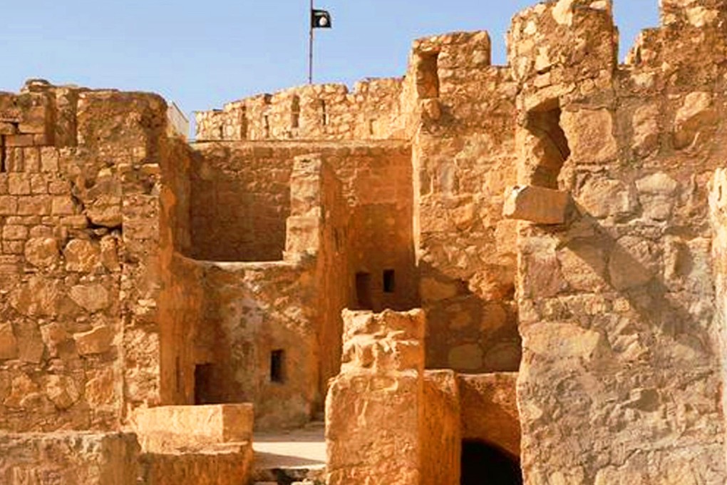 The Islamic State group flag is shown raised on the top of Palmyra castle in the Syrian city that fell to the militants. Photo: AP