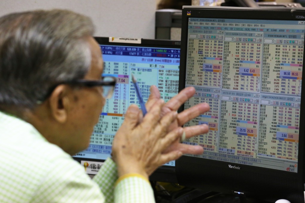 An investor looks at prices in Hong Kong's stock market. Fund managers in the territory may find it difficult to sell their products in mainland China, a report by Z-Ben Advisors said. Photo: Nora Tam