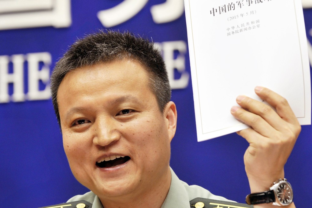 Yang Yujun, spokesman at China's Ministry of National Defense, answers questions about the new white paper on military strategy in Beijing. Photo: Kyodo