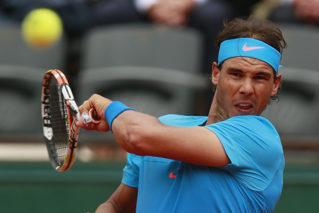 Rafael Nadal returns to young Frenchman Quentin Halys. Photo: Reuters