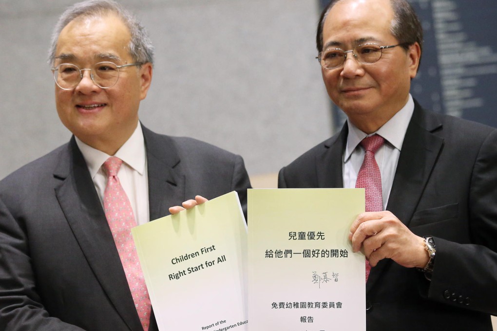 Moses Cheng (left), who chairs a panel on free kindergarten education, releases its report with education minister Eddie Ng. Photo: K. Y. Cheng