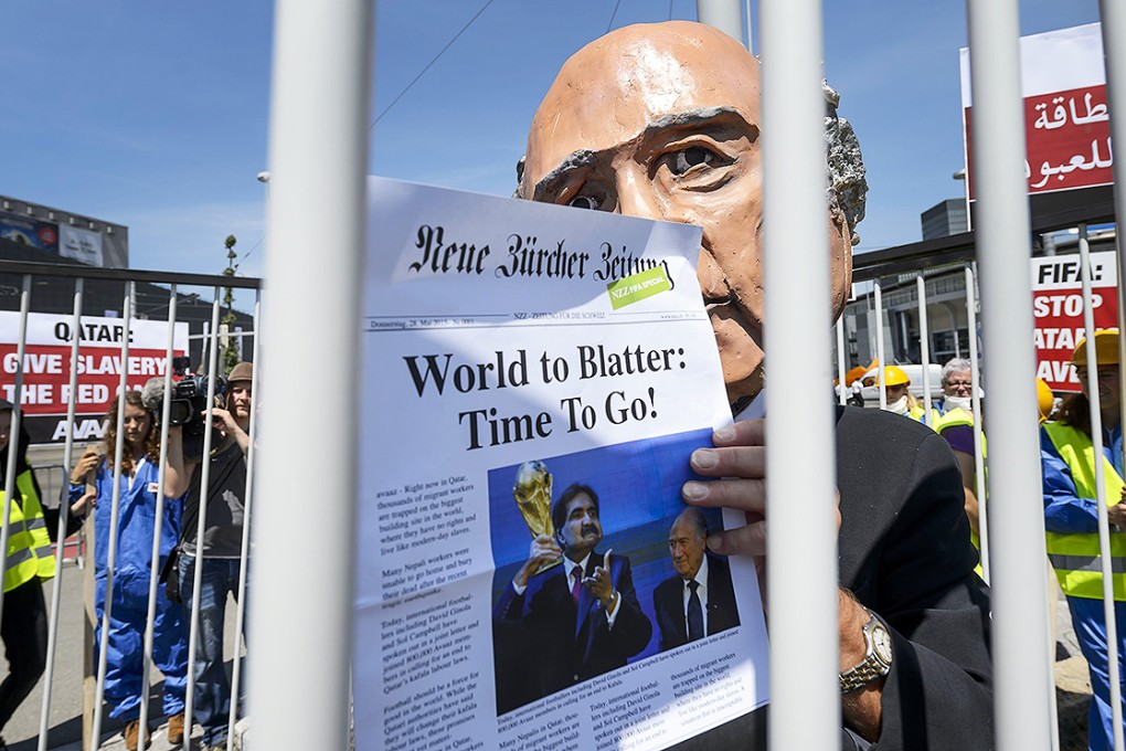 A demonstrator disguised as Fifa President Sepp Blatter takes part in a protest against the condition of workers in Qatar in Zurich. Photo: AFP