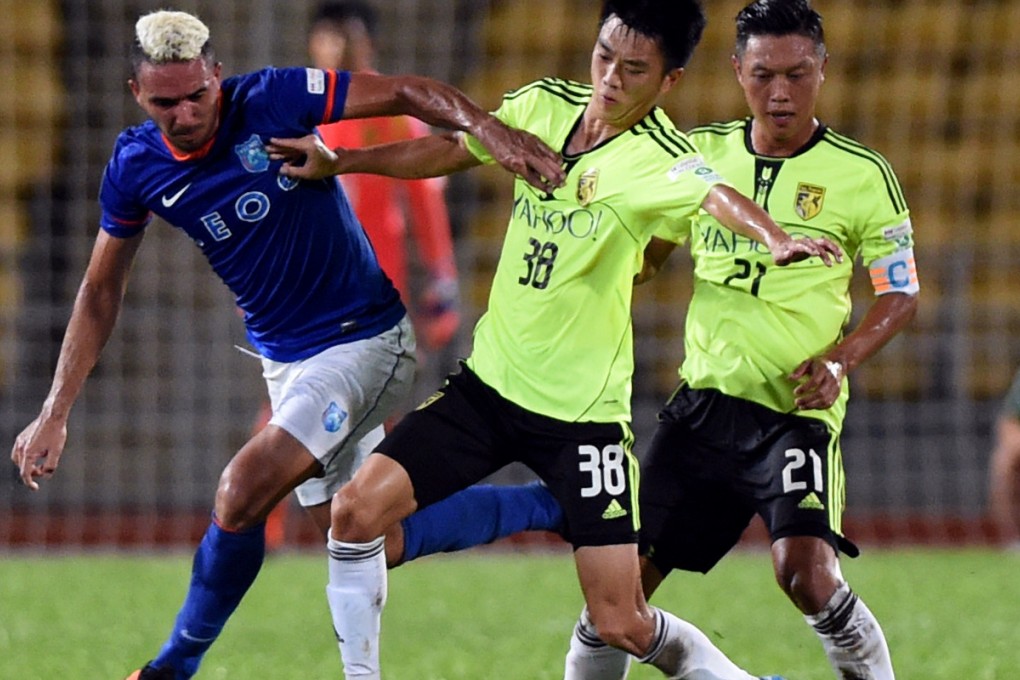 YFCMD's Brazilian striker Fernando Pedreira tries to tackle Sun Pegasus players in their AFC Cup play-off replay last night. Pedreira scored a brace. Photo: Xinhua