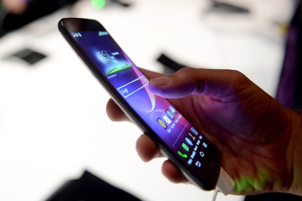 A team of Hong Kong-based researchers have developed a smartphone screen that could be harder than sapphire-based technologies and cheaper to produce. Photo: EPA