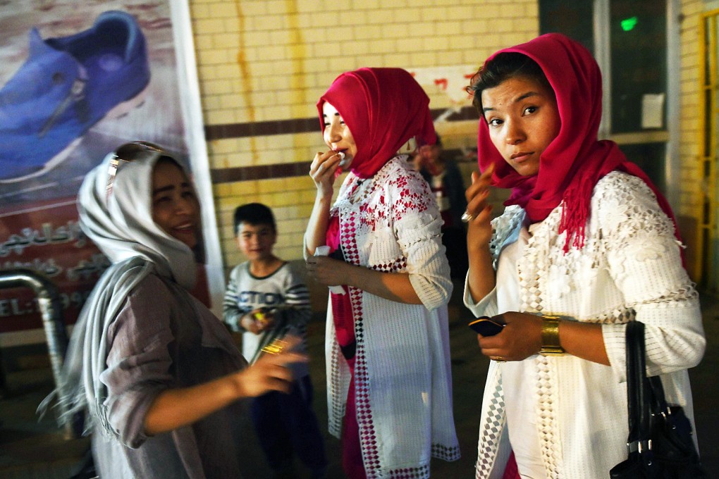 Uygur women at a market place in Hotan in Xinjiang. Uygurs and ethnic Han Chinese in the region rarely mix. Photo: AFP