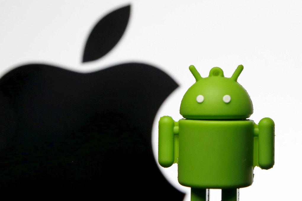 An android mascot stands beside the logo of Apple, a company which is a favorite of Millenials when they invest in companies in the United States. Photo: Reuters