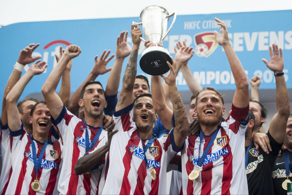 Atletico players celebrate with the trophy after beating West Ham in extra time in the HKFC Citibank Sevens final. Photo: Power Sport Images