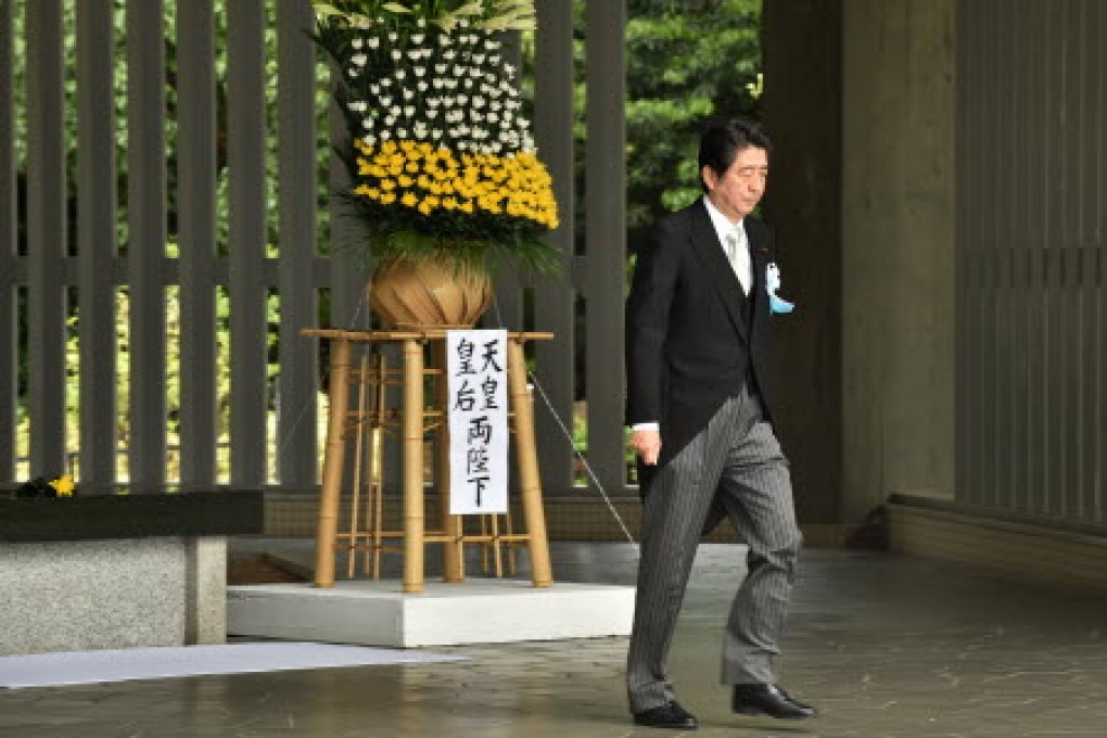 Japanese Prime Minister Shinzo Abe leaves after praying for unknown war victims during an annual memorial service at Tokyo's Chidorigafuchi National Cemetery for unknown war dead in the second world war. Photo: AFP