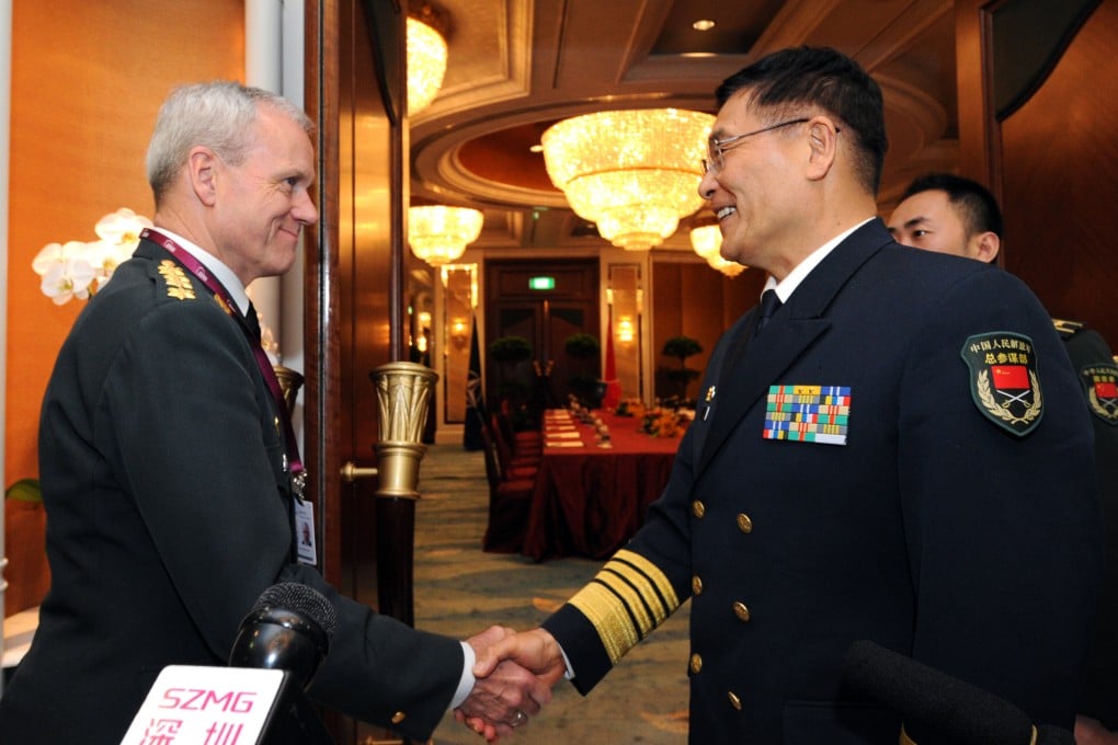 Admiral Sun Jianguo (right) of the Chinese People's Liberation Army shakes hands with the chairman of Nato's Military Committee, Knud Bartels. Photo: Xinhua