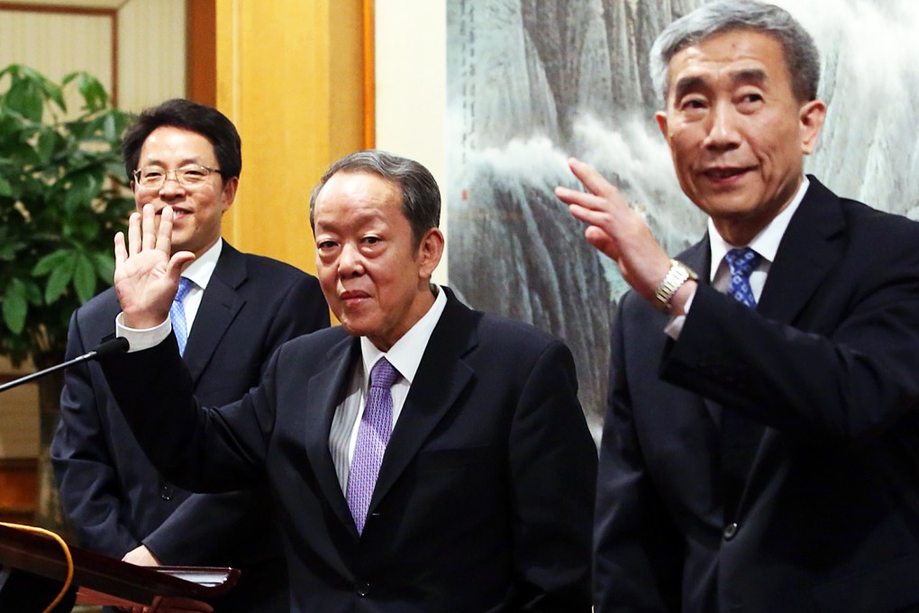 Beijing officials Zhang Xiaoming, Wang Guangya and Li Fei speak to the media after yesterday's meeting. Photo: Sam Tsang