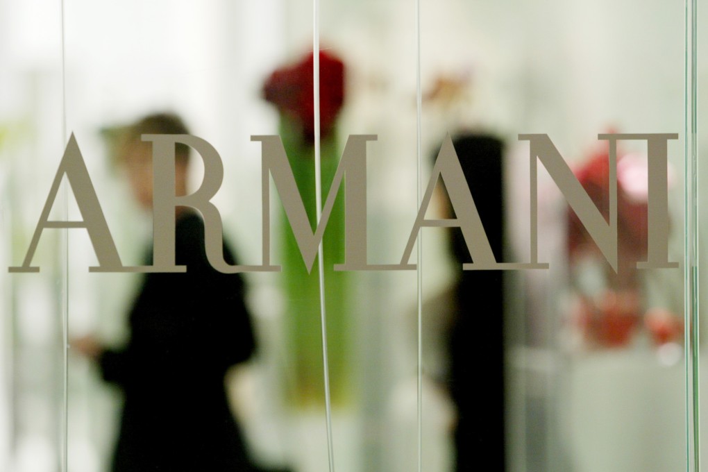 The Armani logo at a store in Hong Kong where fashion manufacturer Ports Design had been offering its products. Ports had just reached a deal to sell a 20 per cent stake to a fund management firm in China. Photo: Reuters