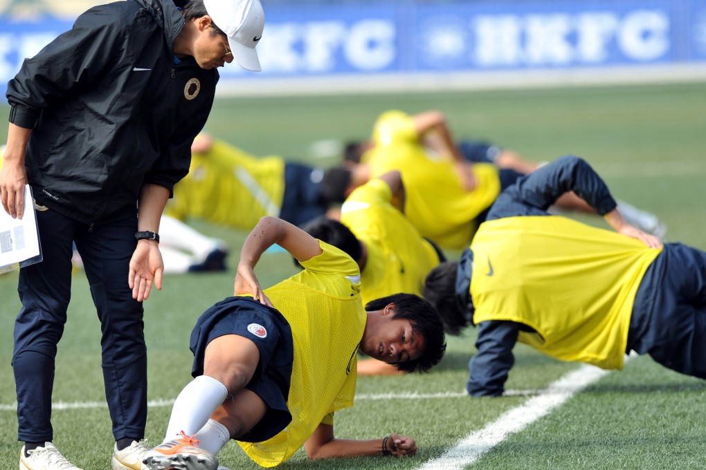 Hong Kong coach Kim Pan-gon puts his charges through their paces. Photo: Xinhua