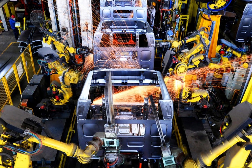 Robots weld car bodies in a factory in Liuzhou in Guangxi province. Automation and digitalisation could help offset declining productivity and a shrinking workforce as the population ages. Photo: ImagineChina