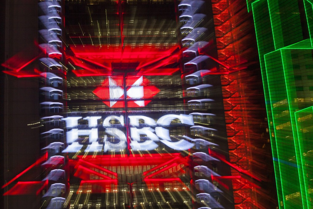 The HSBC logo is seen lighting up the building of the lender in Hong Kong. Sky News is reporting HSBC may announce thousands of job cuts next week. Photo: EPA