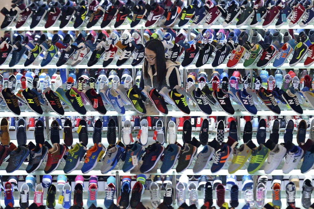 Chinese consumers are increasingly using physical stores to try out goods ... before buying them online at a discount. Photo: Reuters
