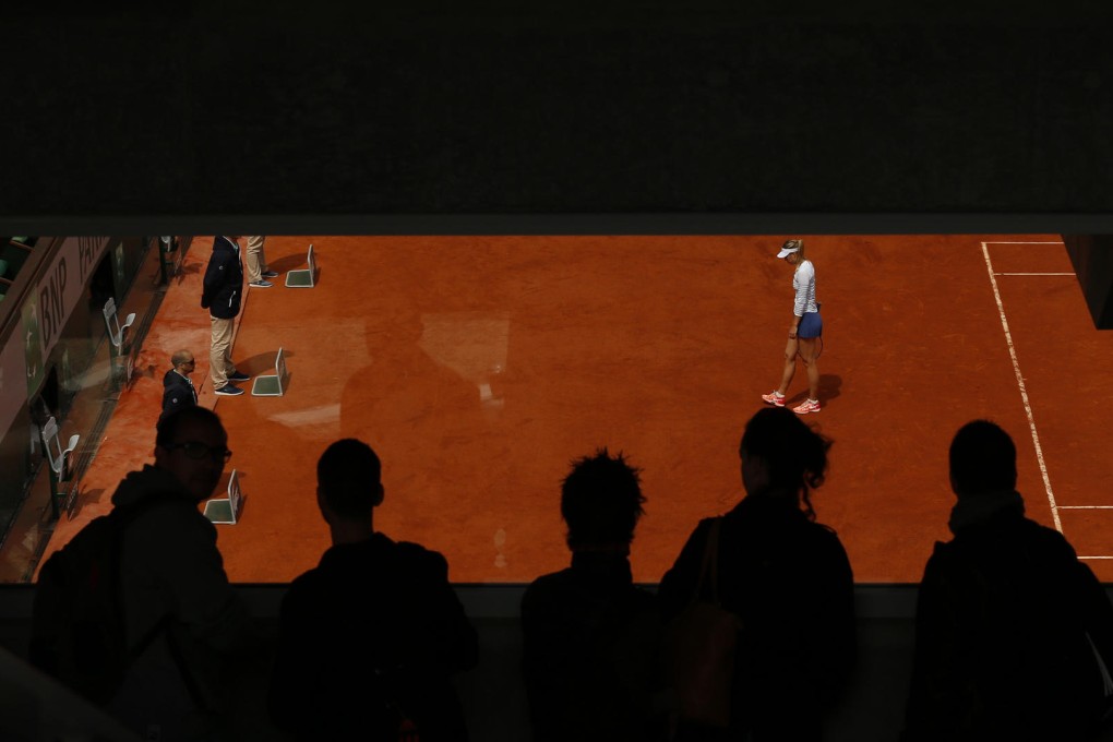 Maria Sharapova cuts a lonely figure in a fourth-round match she lost against Lucie Safarova at the French Open. Photo: Reuters