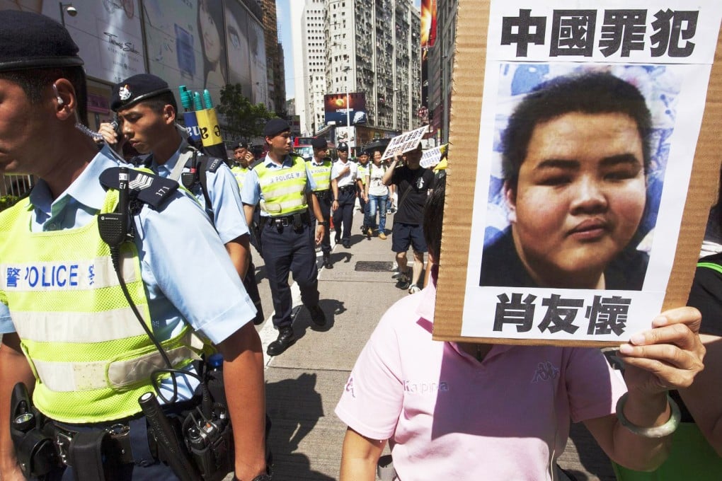 A protest against the decision to give temporary residence in Hong Kong to mainland boy Siu Yau-wai. Photo: EPA