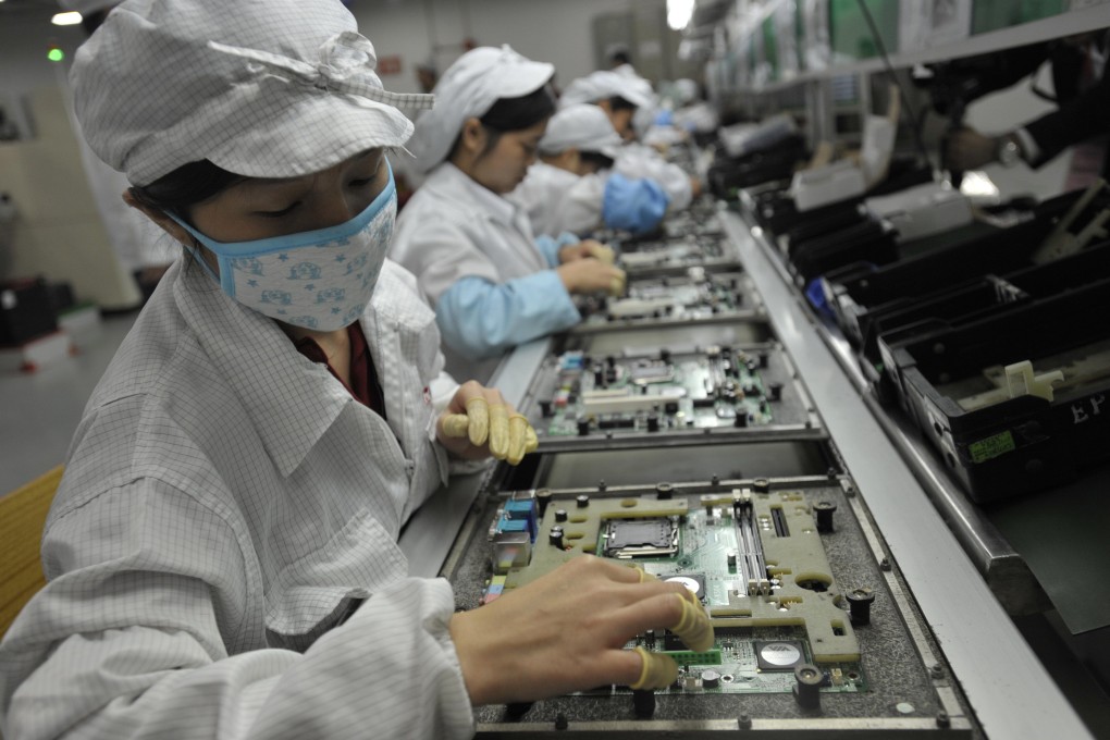 Factory workers produce computer hardware. HWTrek connects start-ups with logistics and manufacturing resources. Photo: AFP