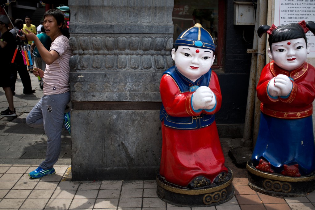 Beijing must encourage a shift towards a services-oriented economy. Photo: AP